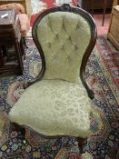 A VICTORIAN WALNUT SPOONBACK CHAIR, the top rail with carved cartouche and leaf decoration, button