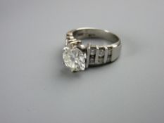 A FOURTEEN CARAT WHITE GOLD DIAMOND DRESS RING having a fine white colour solitaire diamond 8mm