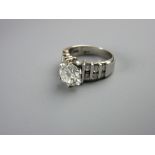 A FOURTEEN CARAT WHITE GOLD DIAMOND DRESS RING having a fine white colour solitaire diamond 8mm