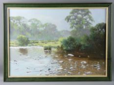 TONY WOODING oil on canvas - river scene with grazing sheep on the bank, signed, 45 x 65 cms