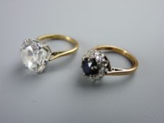 TWO NINE CARAT GOLD DRESS RINGS including a diamond set with central blue sapphire, size 'J' and a