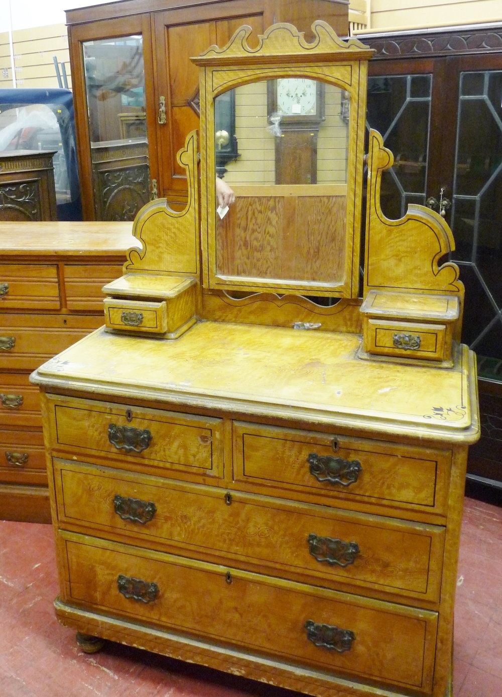 AN EDWARDIAN MAHOGANY MIRROR FRONT WARDROBE, a similar period chest of three long over two short