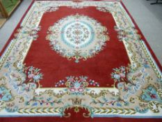 AN EXCELLENT LARGE HAND KNOTTED WOOLLEN CARPET, probably Indian with a central floral pattern