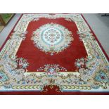 AN EXCELLENT LARGE HAND KNOTTED WOOLLEN CARPET, probably Indian with a central floral pattern