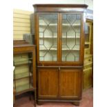 A GEORGIAN OAK & MAHOGANY TWO PIECE CORNER CUPBOARD, the top section with twin thirteen pane