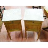 A PAIR OF CONTINENTAL OAK MARBLE TOPPED BEDSIDE CABINETS, the pink marble near square tops over a