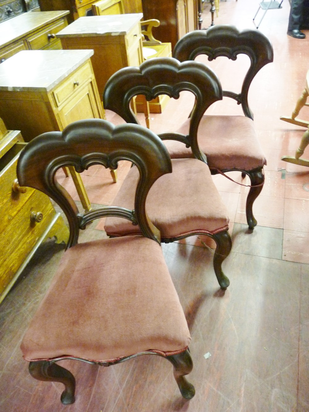 THREE GOOD VICTORIAN SIDE CHAIRS, the triple arched top backs and centre rail with carved