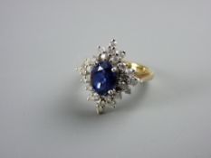 AN EIGHTEEN CARAT GOLD TANZANITE & DIAMOND DRESS RING having a centre oval blue stone with