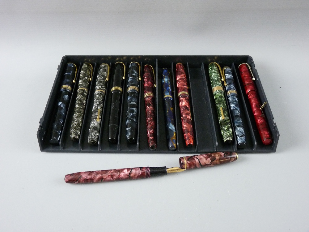 TWELVE CONWAY STEWART FOUNTAIN PENS with fourteen carat gold nibs including a 55, two 28s, two