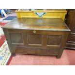 AN ANTIQUE OAK COFFER, the three plank moulded edge top lifting to reveal an interior candle box,