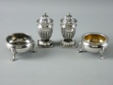 A PAIR OF CIRCULAR SILVER SALT CELLARS on three hoof feet, one gilded, 2.3 troy ozs, London 1758 and