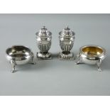 A PAIR OF CIRCULAR SILVER SALT CELLARS on three hoof feet, one gilded, 2.3 troy ozs, London 1758 and