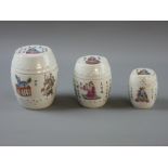 THREE CHINESE PORCELAIN GRADUATING BARREL SHAPED LIDDED POTS, circa 1900, decorated with various