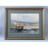 EARLY 20th CENTURY ENGLISH SCHOOL watercolour - river bridge with beached boats, 24 x 34 cms