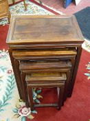 A QUARTETTO OF CHINESE HARDWOOD SIDE TABLES, 66 cms high, 48.5 cms wide, 32.75 cms deep the largest