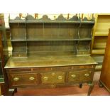 A 19th CENTURY INLAID OAK SHROPSHIRE DRESSER, the shaped open top rack with lower drawers, the