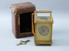 A VICTORIAN FRENCH GILT BRASS CARRIAGE CLOCK & CASE, the clock case with bevelled glass panels and