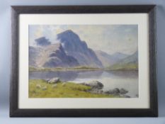 WARREN WILLIAMS ARCA watercolour - Ogwen Lake with boat and figure, signed, 32.5 x 50 cms