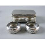 A HALLMARKED SILVER TRINKET BOX and a cased pair of napkin rings, the rectangular box with