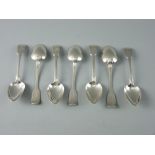 A SET OF SEVEN FIDDLE PATTERNED SILVER DESSERT SPOONS with crested handles, 8.2 troy ozs, Exeter