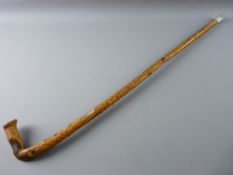 A NATURAL WOOD WALKING STICK carved in Welsh with the Ten Commandments, 93 cms long