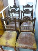 A SET OF SIX EDWARDIAN MAHOGANY DINING CHAIRS with sunburst top rail decoration, spindleback