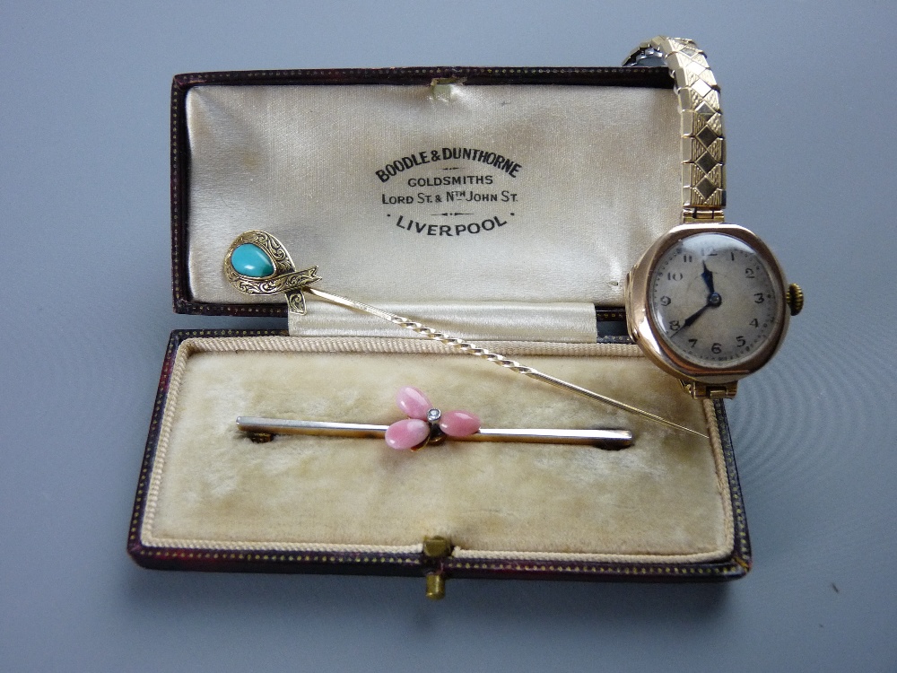 A NINE CARAT GOLD CASED LADY'S WATCH and a Victorian stickpin, the watch with expanding metal
