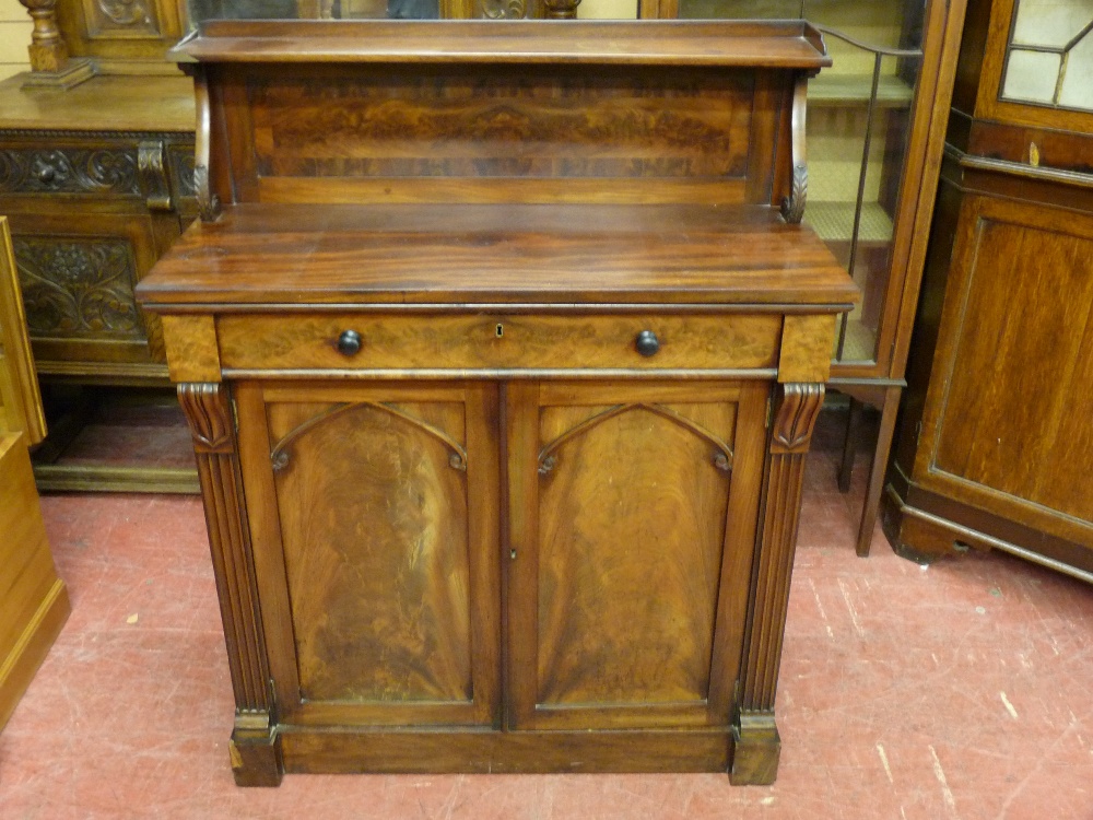 A VICTORIAN MAHOGANY CHIFFONIER with top shelf section on carved corbel supports, single frieze