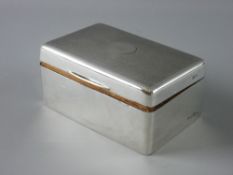 A HALLMARKED SILVER CIGARETTE BOX, the lidded top with engine turned decoration, Birmingham