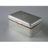 A HALLMARKED SILVER CIGARETTE BOX, the lidded top with engine turned decoration, Birmingham