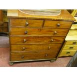 A LARGE LATE VICTORIAN MAHOGANY CHEST of two short over four long drawers with turned wooden knobs