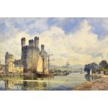 JOHN E AITKEN watercolour - the harbour at Caernarfon with numerous boats alongside eagle tower,