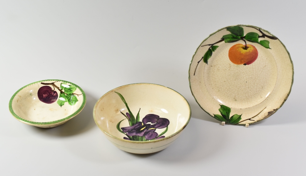 THREE ITEMS OF LLANELLY POTTERY comprising plum decorated fruit dish, bowl with irises and plate - Image 2 of 2