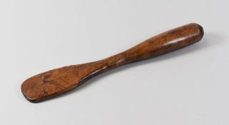 A NINETEENTH CENTURY FRUITWOOD TREEN SPATULA, 26cms long