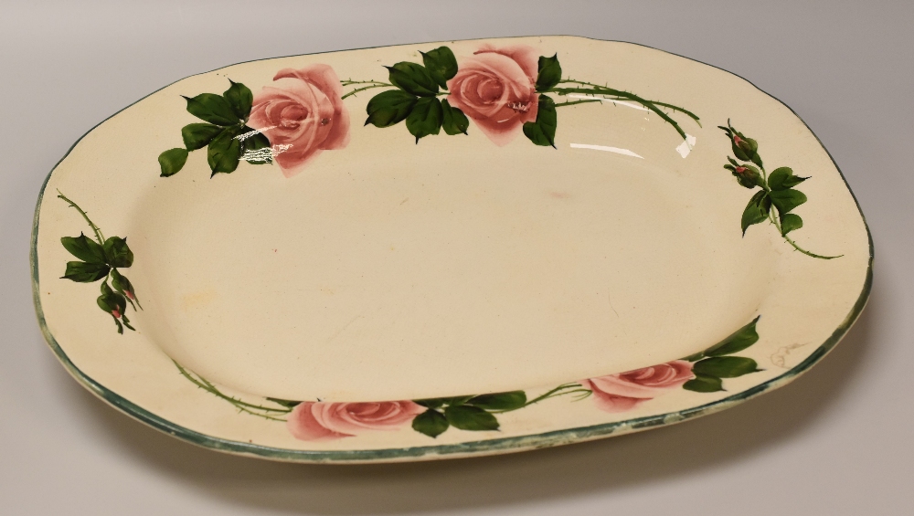 A LARGE LLANELLY POTTERY HYBRID TEA-ROSE PLATTER the border with stems of open and closed roses