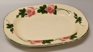 A LARGE LLANELLY POTTERY HYBRID TEA-ROSE PLATTER the border with stems of open and closed roses