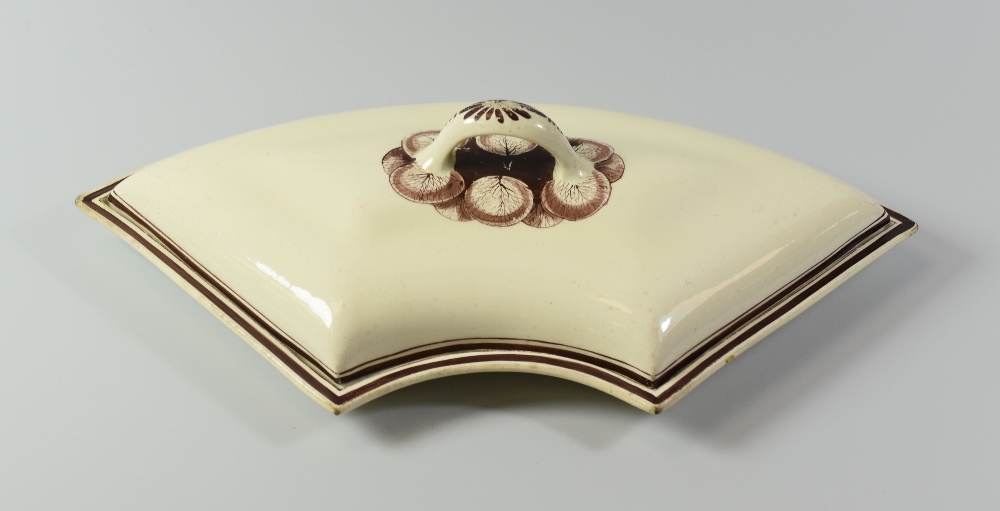 A SWANSEA CREAMWARE SUPPER-SET PART circa 1805, of curved form with loop handle and with painted