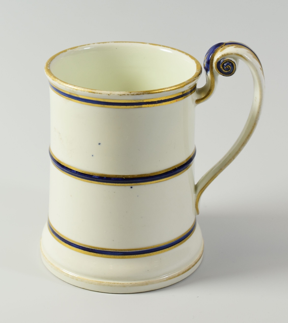 A RARE SWANSEA PORCELAIN TANKARD (smaller version) of slightly tapered form with everted rim, the