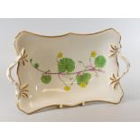 A SWANSEA PORCELAIN BOTANICAL DISH, circa 1805, of shaped rectangular form and with twig-handles and