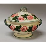 A LLANELLY POTTERY HYBRID TEA-ROSE DECORATED TUREEN of oval footed form with loop handle to the