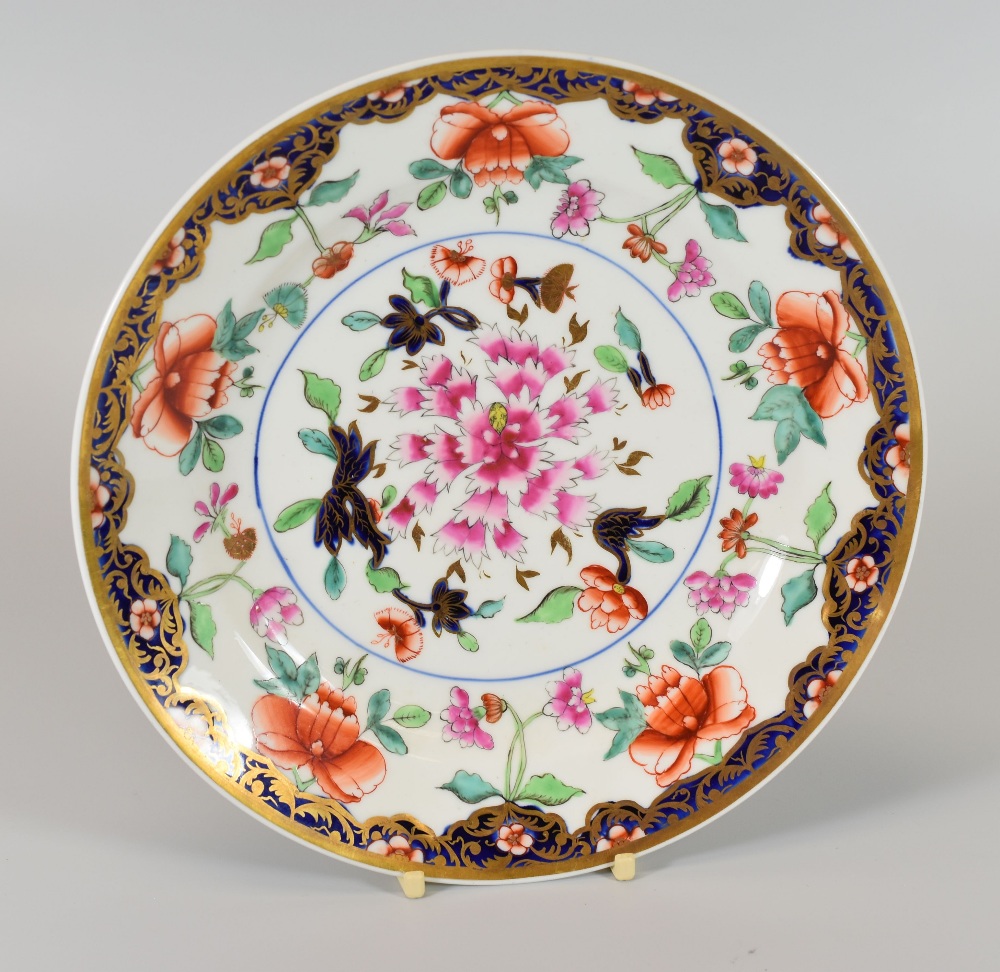 A SWANSEA PORCELAIN ORIENTAL STYLE PLATE circa 1818, with border of gilt foliage and pink flowers on