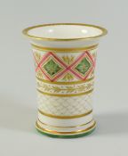 A SWANSEA PORCELAIN SPILL VASE with flared rim and with ridged and footed base, the body decorated