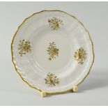 A SWANSEA PORCELAIN EGG CUP SAUCER of lobed circular form, with basket weave moulding to the