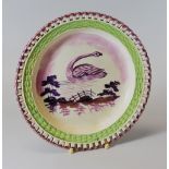 A DILLWYN SWANSEA POTTERY PLATE WITH ARCADED BORDER circa 1815-20 with lustre rim, green glazed