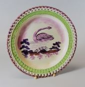A DILLWYN SWANSEA POTTERY PLATE WITH ARCADED BORDER circa 1815-20 with lustre rim, green glazed