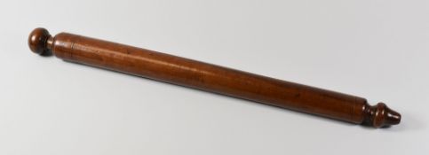 A FRUITWOOD TREEN SCROLL-WINDER from a South East Wales family, 42cms long