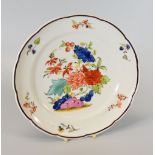A NANTGARW PORCELAIN PLATE WITH CHOCOLATE COLOURED EDGE, circa 1818-20, with lobed rim, the border