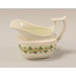 A SWANSEA PORCELAIN CREAM JUG having a wide elongated spout with spurred and shouldered loop handle,