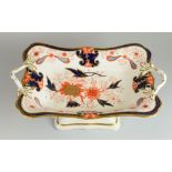 A SWANSEA PORCELAIN CENTRE DISH COMPORT circa 1815-17 raised on a shaped rectangular base and with