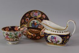 A SWANSEA PORCELAIN CUP, SAUCER & JUG IN PATTERN 219, decorated in underglaze deep blue, profusely